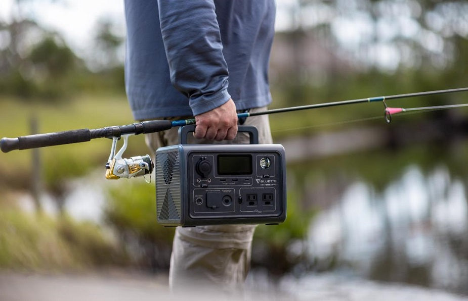 Bluetti EB3A carried by its top handle on a fishing trip