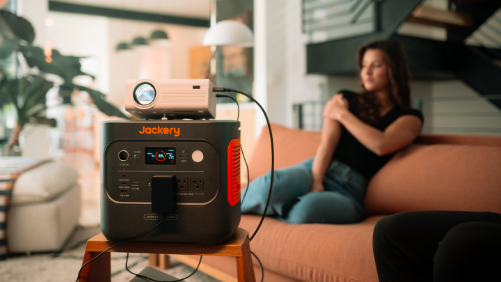 Jackery Explorer 2000 v2 powering a home projector in a living room