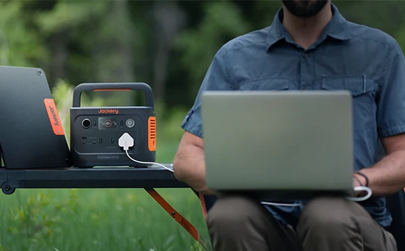 Jackery Explorer 300 Plus powering a laptop at a campsite